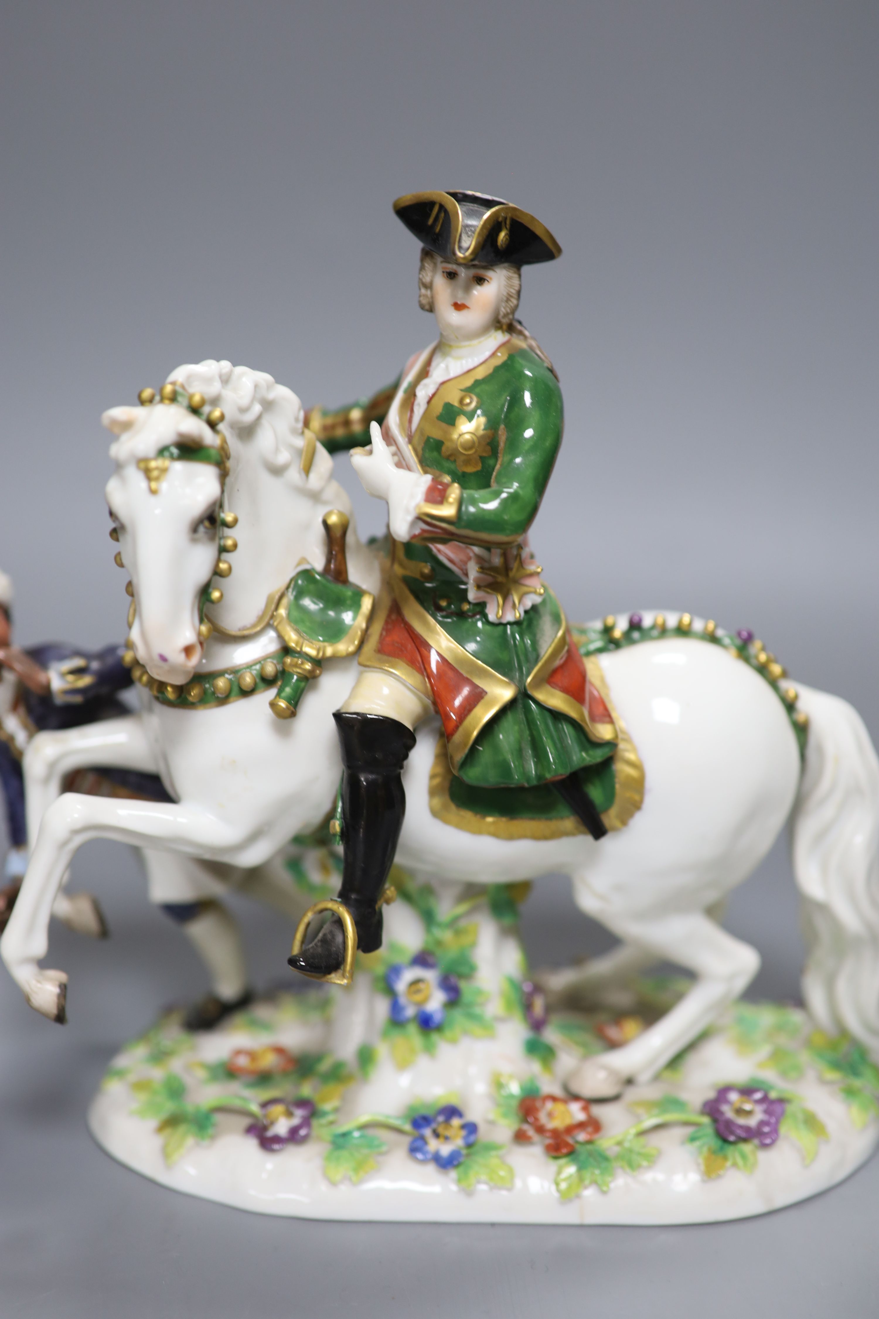 A Continental porcelain figure group, an overlaid glass goblet and a Royal Crown Derby miniature cup, tallest 20cm